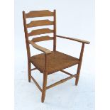 A Cotswold school ladder back chair, with turned supports and outswept arms,