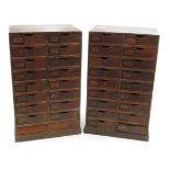 Two banks of eighteen drawers, each applied with metal card holders and carved handle apertures,