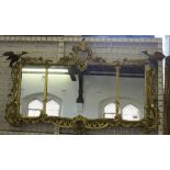 An 18th century design triple plate overmantel mirror, decorated with open scrolls,