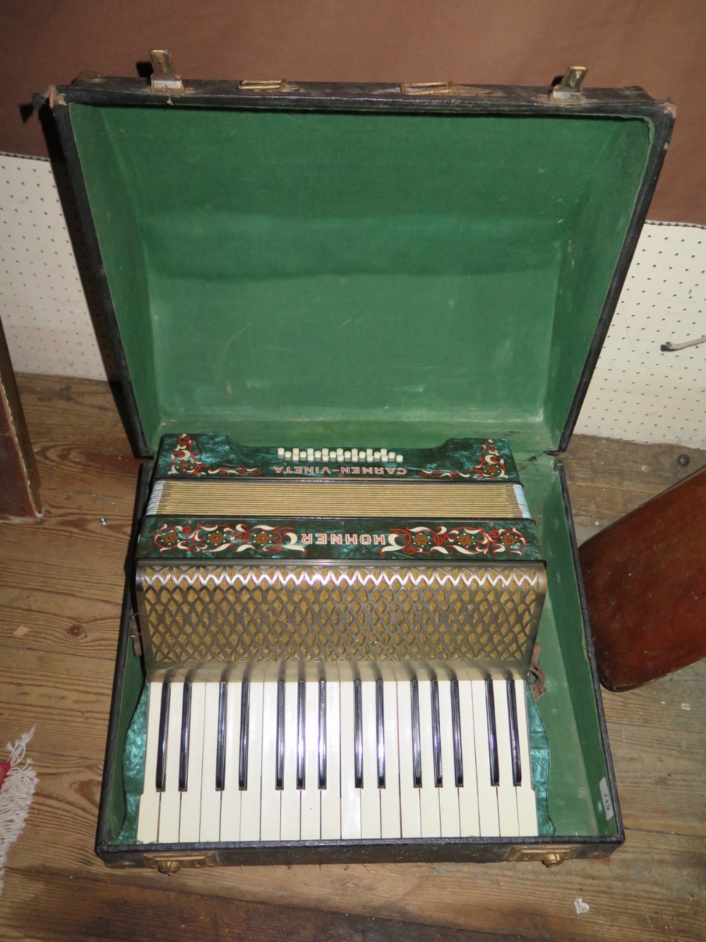 A Hohner Carmen-Vineta Accordian in case