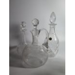 An Engraved Glass Decanter and two others