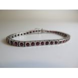 A Ruby and White Metal Line Bracelet