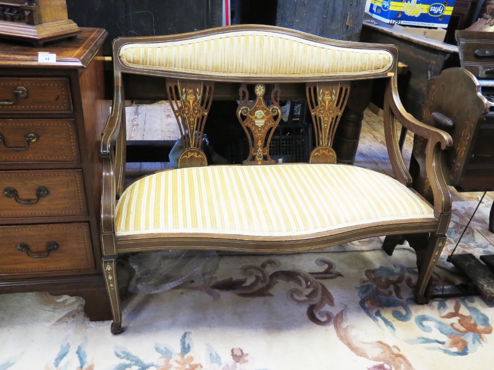 An Edwardian Mahogany and Strung Two Seater Settee