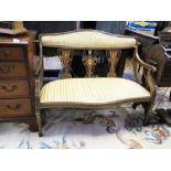 An Edwardian Mahogany and Strung Two Seater Settee