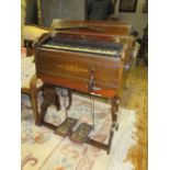 A late 19th century 39 key ebonised harmonium by Boyd of London