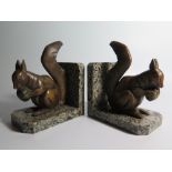 A Pair of Art Deco Squirrel Bookends on granite bases
