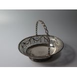 A Small George III Silver Swing Handled Basket with engraved foliate swag decoration, London 1771,