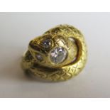 A Diamond three stone snake ring, central stone c. 0.5ct, marked 800 (19ct gold)