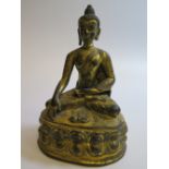 A Tibetan Gilt Bronze Figure of Buddha seated in dhyanasana on a double-lotus base with the hands in
