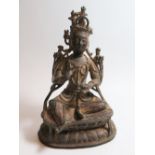 A Rare Tibetan Copper Alloy Dhyani Amoghasiddhi Buddha with gilt and red lacquer, c. thirteenth /