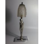 An Art Deco Chrome Figural Table Lamp of standing nude with frosted glass shade