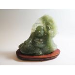 A Large Carved Jadeite Buddha Figure