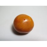 A Massive Baltic Amber Bead, 50g, c. 14cm circumference