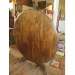 A Large Early Nineteenth Century Rosewood Tilt Top Dining Table raised on single pedestal with