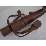 A British Army Three Draw Leather Bound Brass Telescope with extra high power eyepiece by