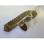 A 9ct Gold Bracelet with Heart Clasp