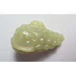 A Chinese Jade carved as a bunch of grapes with gerbil, 6cm