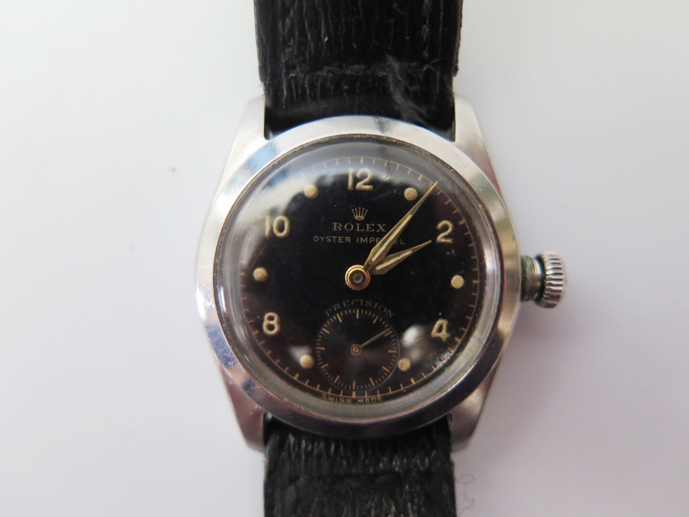 A 1940's Rolex Oyster Imperial Precision Wristwatch in steel case, the black dial with arabic