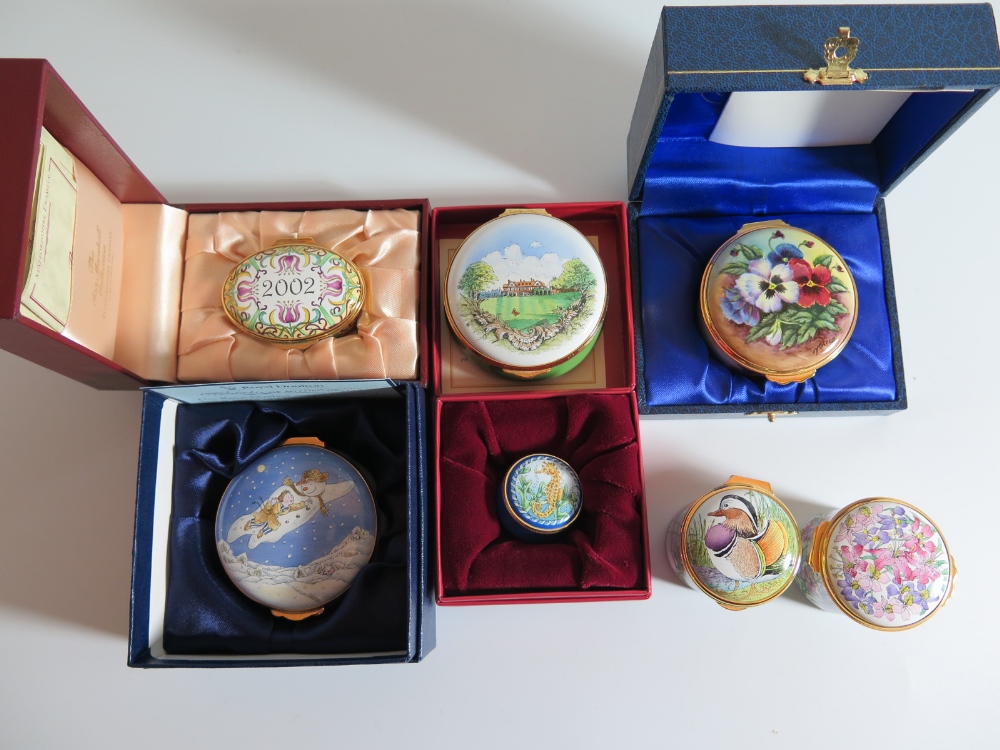 A Collection of Seven Enamel Boxes including Royal Doulton 'The Snowman'