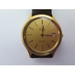 An Omega De Ville in gold plated case with quartz movement