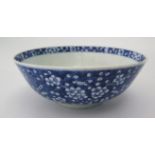 A Chinese Nineteenth Century Blue and White Prunus Decorated Bowl, four character mark to base, 20