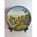 An Italian Maiolica Shallow Dish decorated with goatherd scene, 28.5 cm