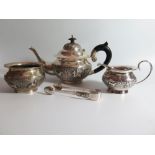 An Indian Silver Silver Three Part Tea Set and sugar tongs, stamped 90, sucrier handles loose, 857