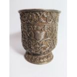 A Heavy Indian Silver Mug with extensive floral and foliate scroll decoration with vine and grape