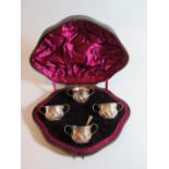 A Victorian Presentation Cased Set of Four Silver Salts and single spoon, London 1888, John