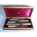 A Victorian Five Piece Ivory Handled and Silver Banded Carving Set in original plush lined