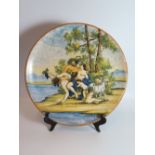 An Italian Maiolica Charger decorated with Bacchanalian scene, 37 cm