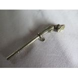 A White Metal Watch Key in the form of a horse's leg and hoof