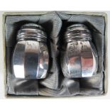 A Pair of American Sterling Silver Peppers