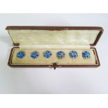 A Cased Set of Six Silver Enameled Buttons