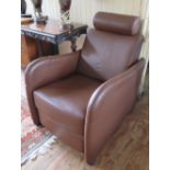 A Ligne Roset Reclining Armchair in tan leather upholstery