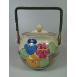 A Clarice Cliff Bizarre Biscuit Barrel with swing handle (slight chip to inner rim)