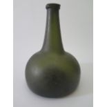 An Early Mallet Shaped Green Glass Bottle, 20 cm