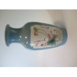 A Chinese Pale Blue Ground Porcelain Vase decorated with two floral cartouche, six character mark to