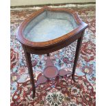 An Edwardian Satinwood Bijouterie Display Table with ebony stringing, of shield shape and with