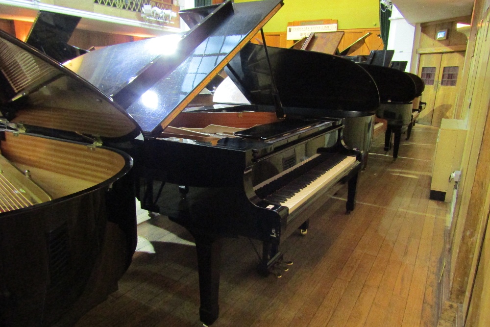 Yamaha (c1995) 
A 6ft 11in Model C6 grand piano in a bright ebonised case on square tapered legs.