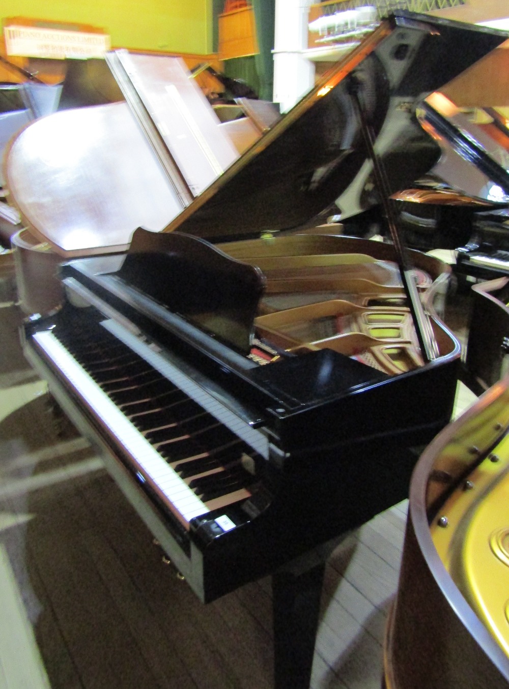 Yamaha (c2000)
A 5ft 3in Model GP1 grand piano in a bright ebonised case on square tapered legs.