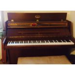 Schimmel (c1983) 
A modern style upright piano in a mahogany case together with a duet stool.