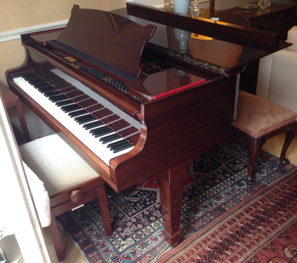 Steinway (c1936) 
A 5ft 1in Model S grand piano in a mahogany case on square tapered legs.