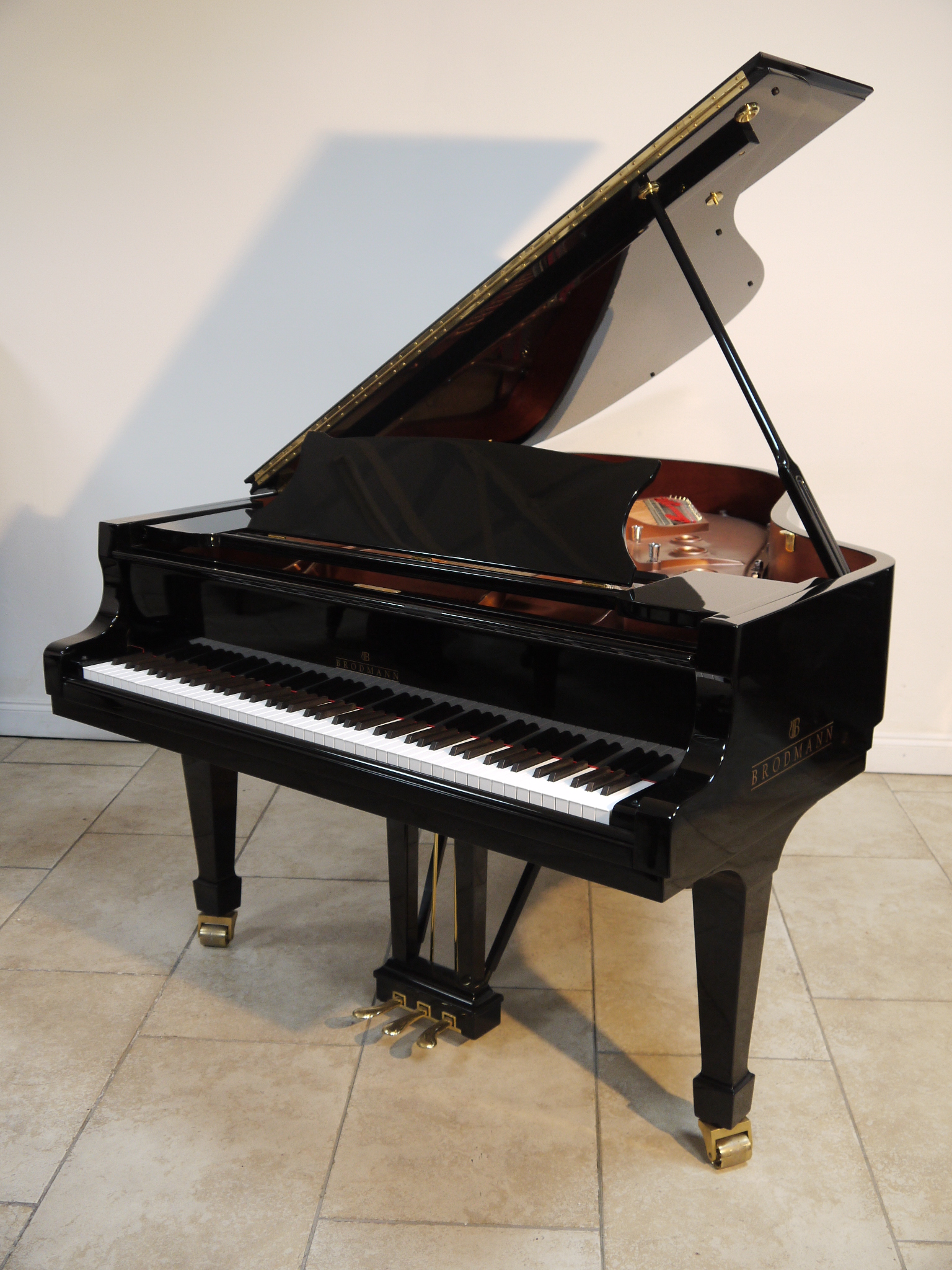 Brodmann
A very recent 6ft 1in Model 187 grand piano in a bright ebonised case on square tapered