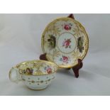 An H & R Daniel porcelain breakfast cup and saucer, First Gadroon pattern, decorated with roses