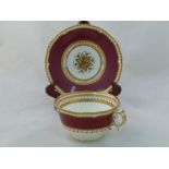 An H & R Daniel porcelain breakfast cup and saucer, First Gadroon shape, decorated with maroon bands