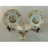 An H & R Daniel porcelain cream bowl and cover and two plates, Shell Pierced shape, with vine and