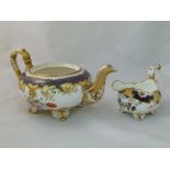 An H & R Daniel porcelain cream jug and teapot, the cream jug Shrewsbury shape with acanthus