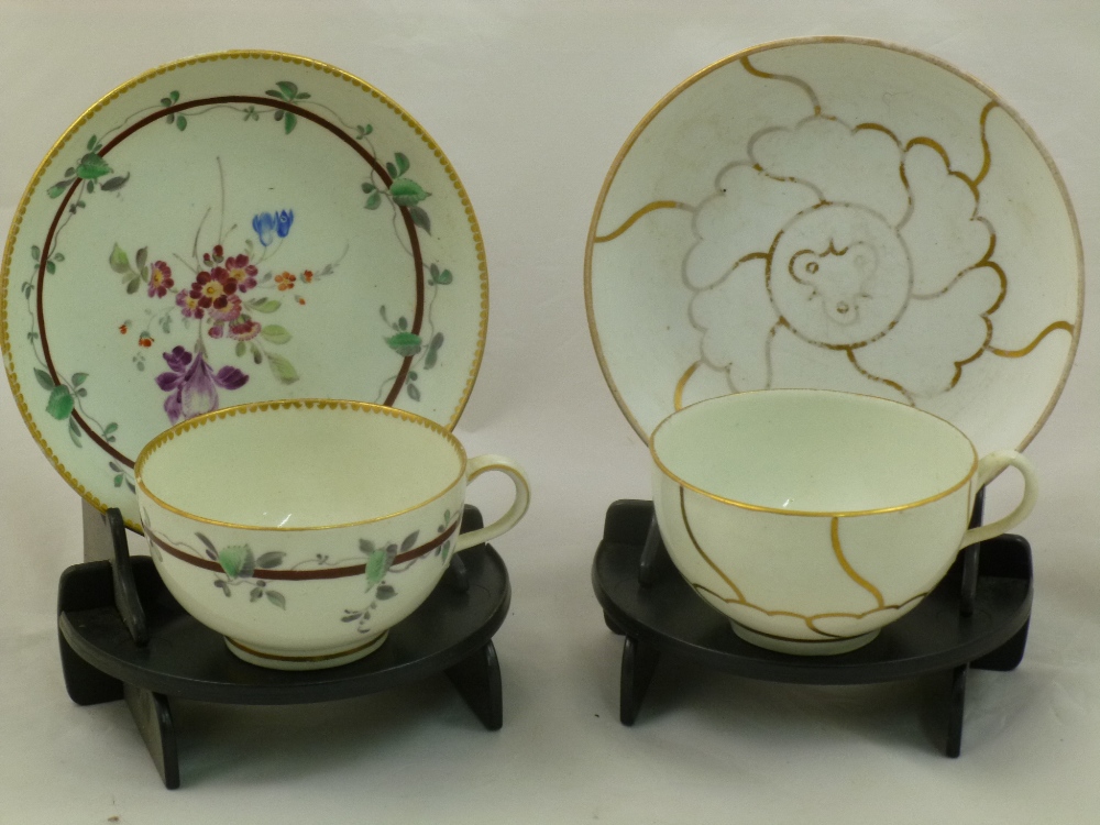 Two Worcester porcelain tea cups and saucers, bearing the Meissen crossed swords mark and the no.