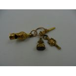 A miniature Victorian gold whistle, 35mm long, a gold watch key, 29mm long,
